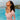 Woman in a pink Speedo Wavechasers 2.0 crop zip vest, highlighting sun protection, chlorine resistance, and high elasticity.