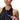 Woman zipping up a black Speedo Asia Fit Colorblock 1 Piece swimsuit with a pink pull tab.